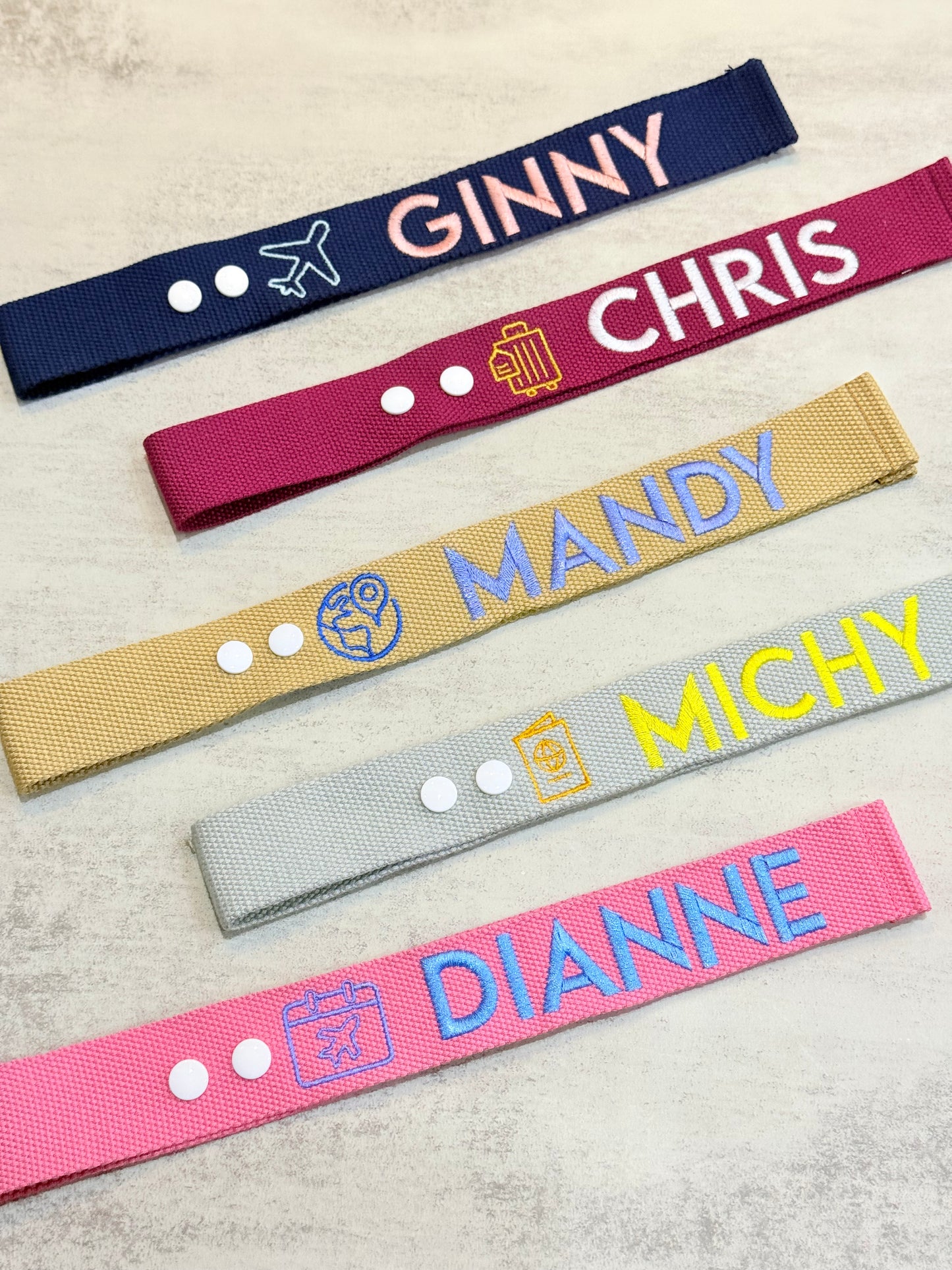 Colourful luggage tag with icons and removable snap buttons