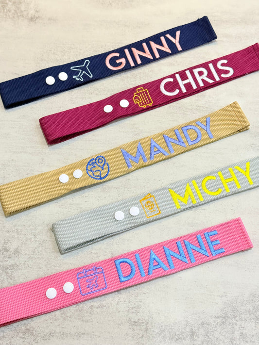 Colourful luggage tag with icons and removable snap buttons